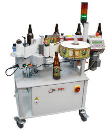 Geset_121_Wrap_Labeler_with_bottle.jpg Geset_121_Wrap_Labeler_with_bottle.jpg